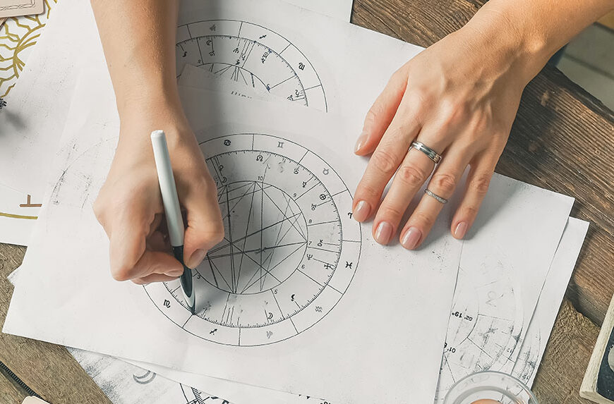 Astrology. Astrologer calculates natal chart and makes a forecast of fate.Tarot cards, Fortune telling on tarot cards magic crystal, occultism, Esoteric background. Fortune telling,tarot predictions.